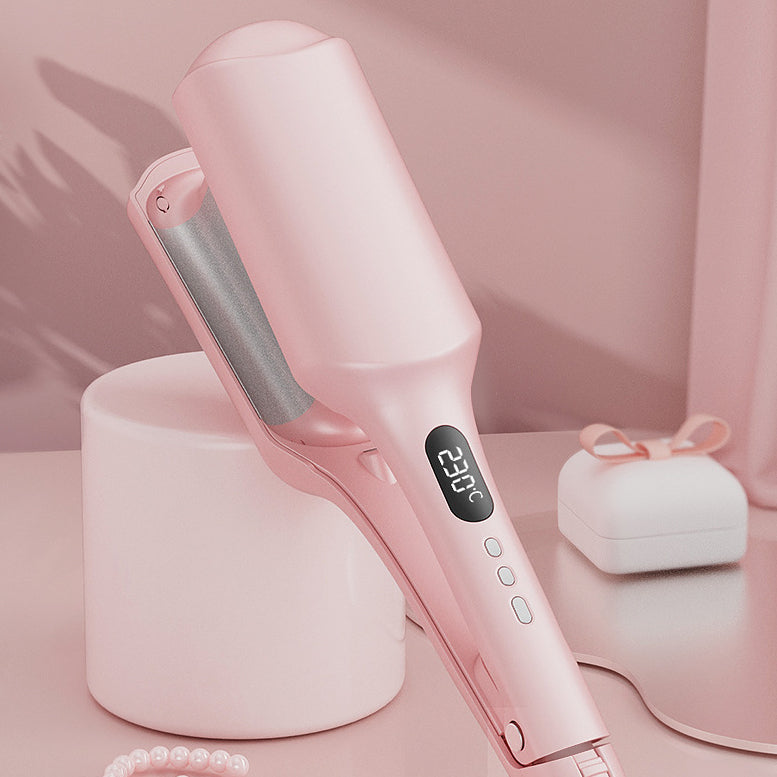 Ultimate Waver Curling Iron for Beach Waves & Hair Styling in pink color on a stylish surface.